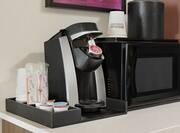 Convenient in-room hospitality center featuring coffee maker and microwave.
