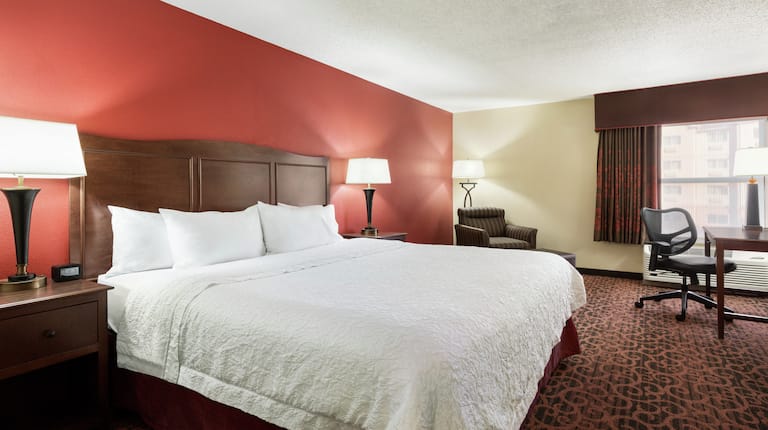 King Bed Room with One King Bed, desk and chair