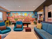 lobby seating area mural and pool table