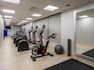 Fitnes center with cardio machines and mirror