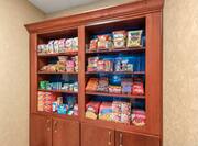 a shelf with food and convenience items