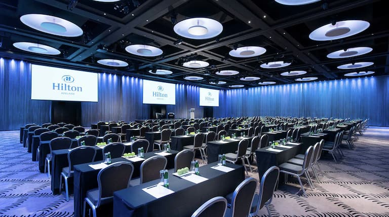Large meeting room with modern decor and tables and chairs
