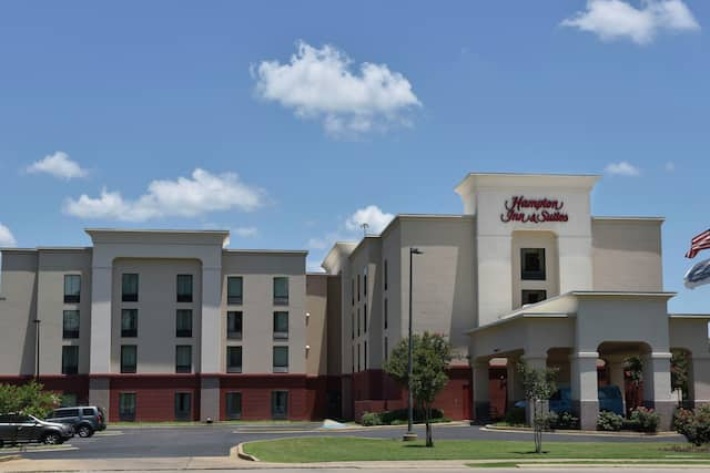 Hotel Exterior with car park and flag flying