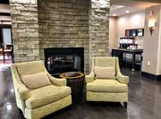 Lobby Area with Soft Seating Around Fireplace