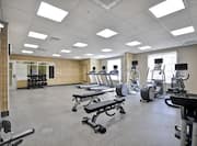 Fitness Center with Weight Benches, Treadmills, Cross-Trainers, Dumbbell Rack and Weight machine