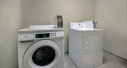 Guest Laundry with Coin-Operated Washing Machine and Tumble Dryer