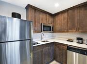 Suite Kitchen with Full Size Fridge, Stove Top, Microwave and Dishwasher