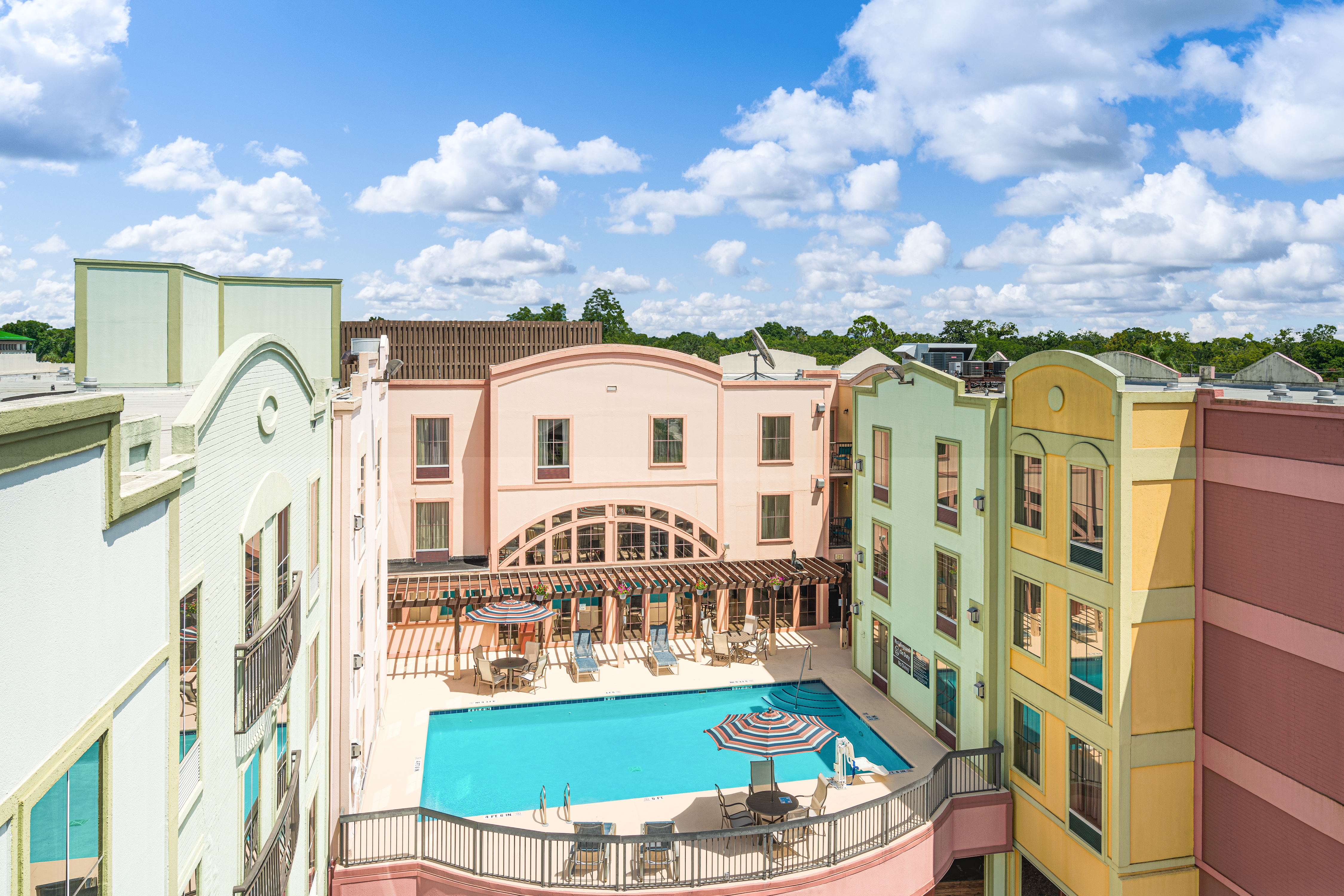 Aerial View of Outdoor Pool and Hotel Exterior