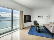 Suite Living Area with Large Windows and Port View