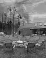 Chairs around a fire pit in evening