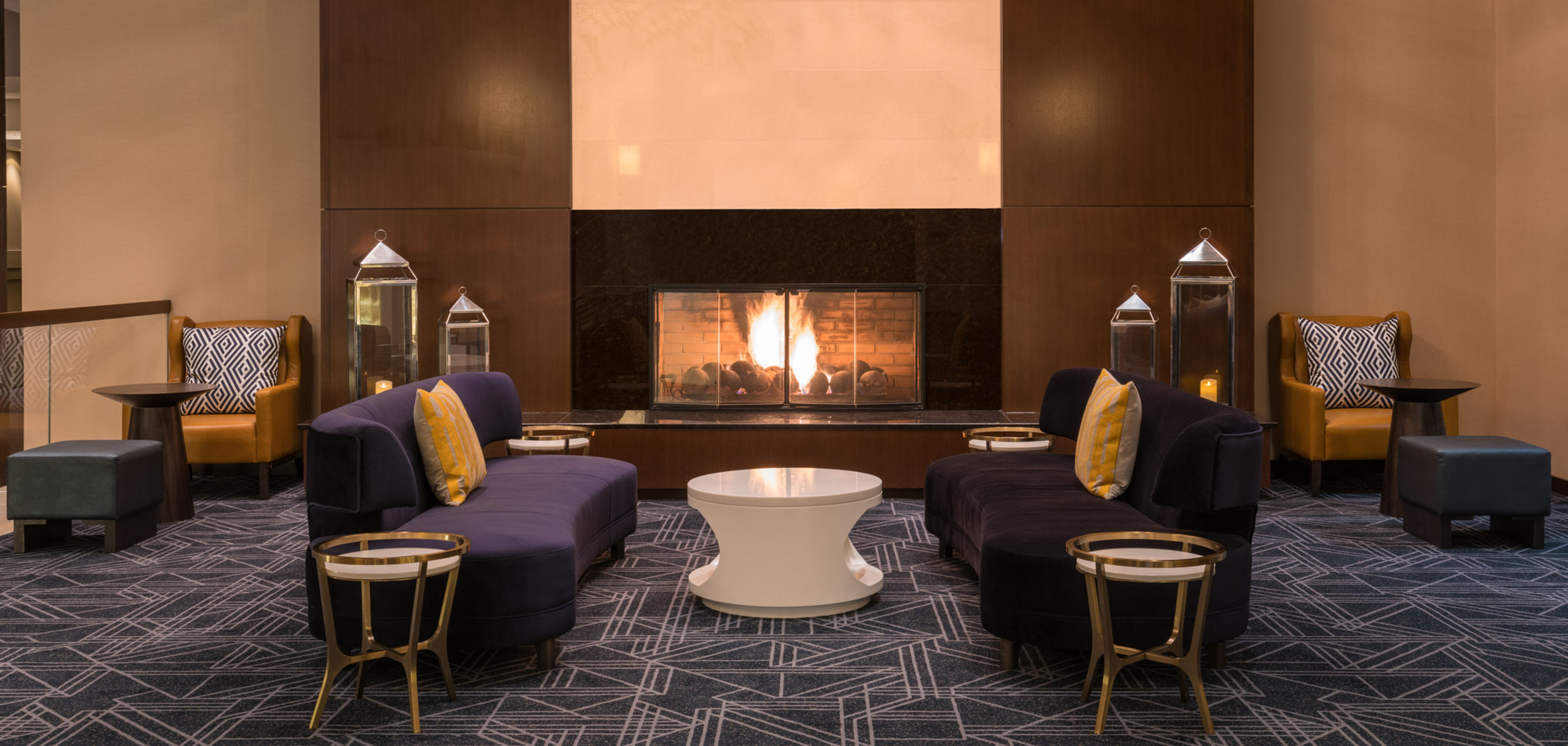 Fireplace in lobby with comfortable seating