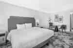 King bedroom with dining table and seating