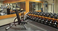 Convenient on-site fitness center fully equipped with cardio machines, exercise equipment, and free weights.