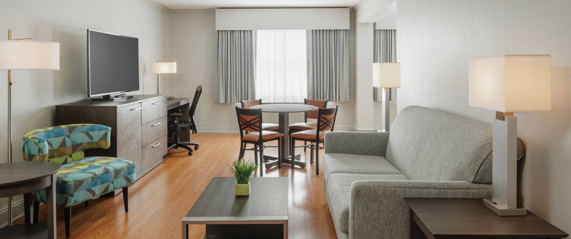 Suite living area with tables and chairs