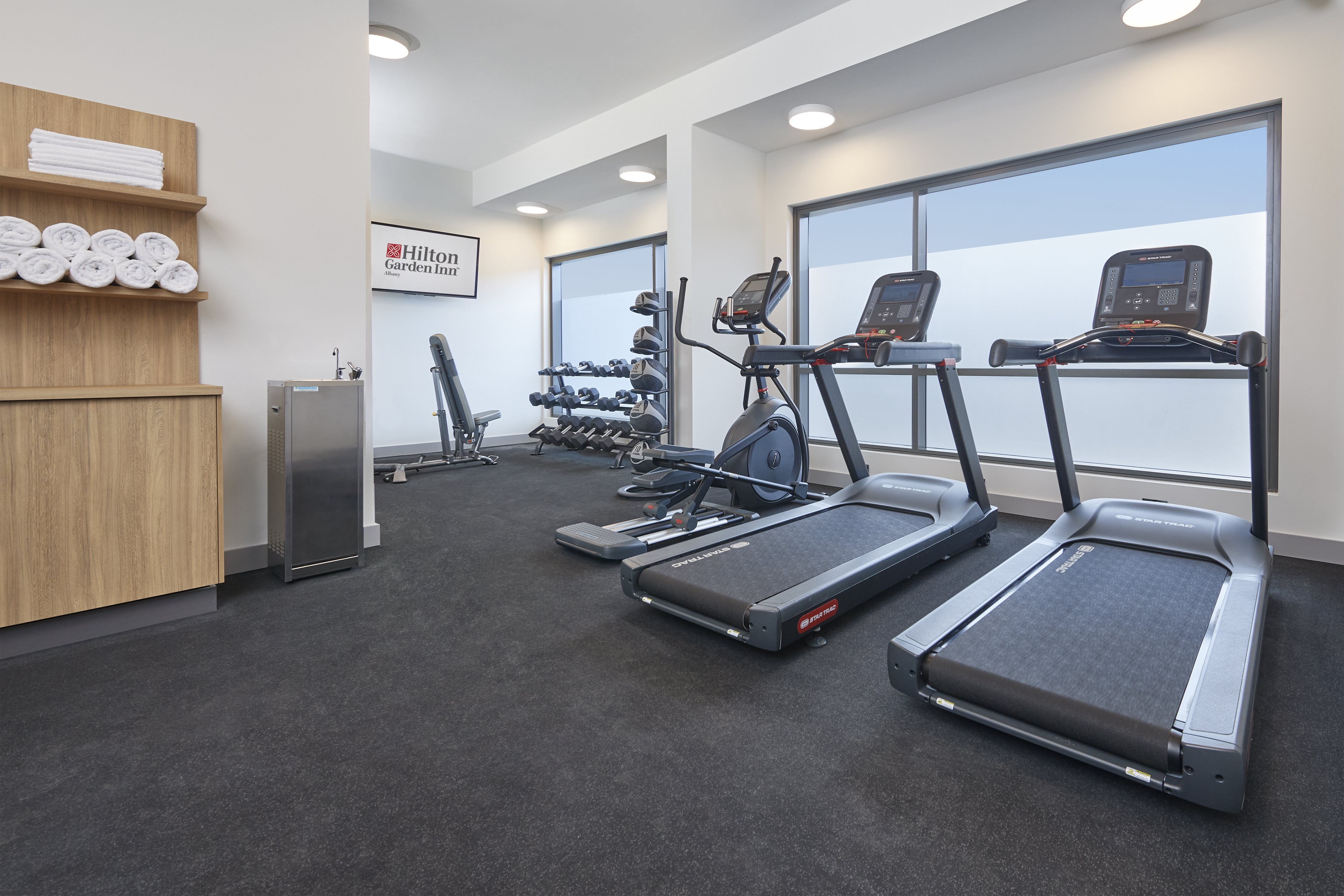 Fitness center cardio machines and free weights