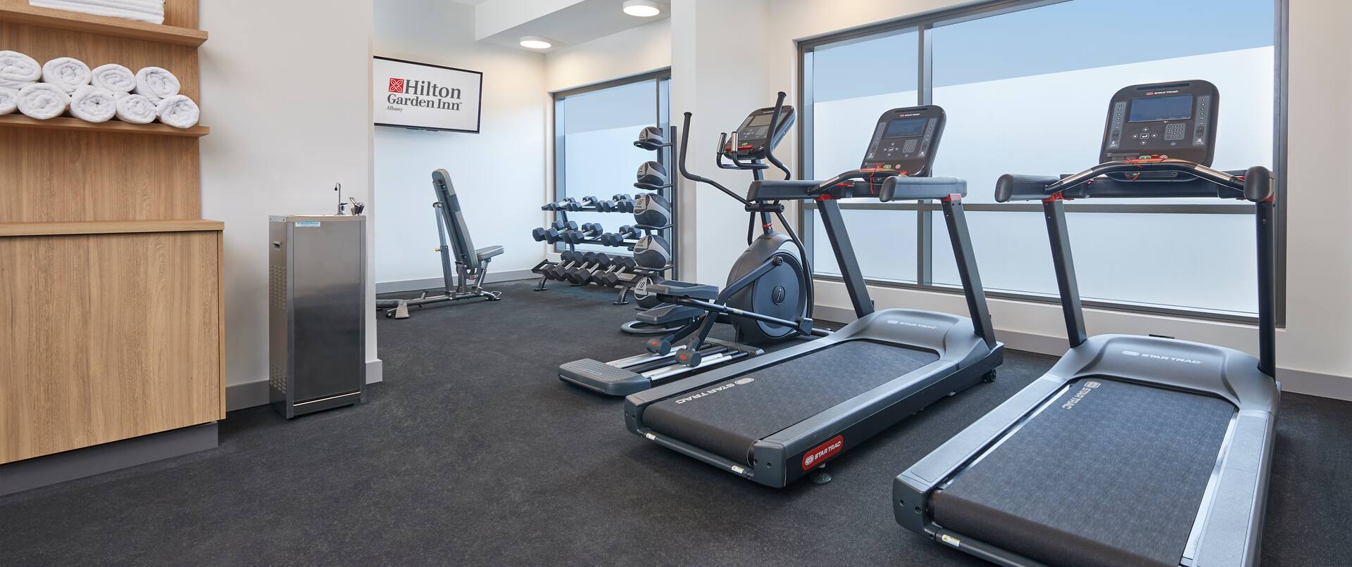 Fitness center cardio machines and free weights