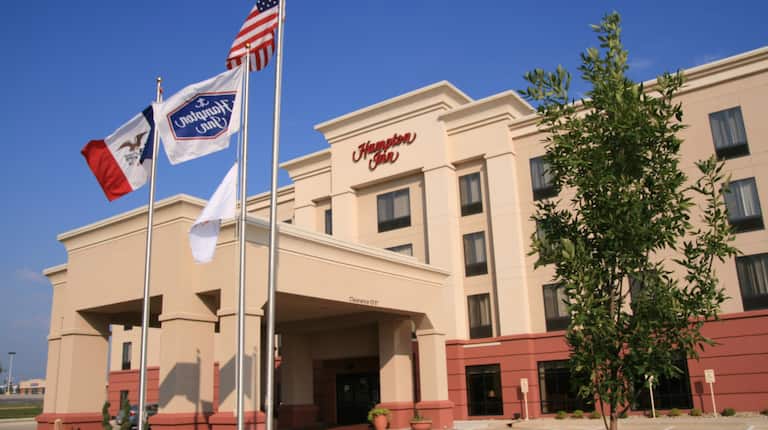 Hampton Inn Hotel Exterior with Flags