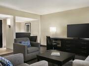 Suite Living Area with Sofa Armchairs and TV