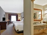 Suite with Two Queen Beds, Lounge Area, Work Desk, Room Technology, and Bathroom
