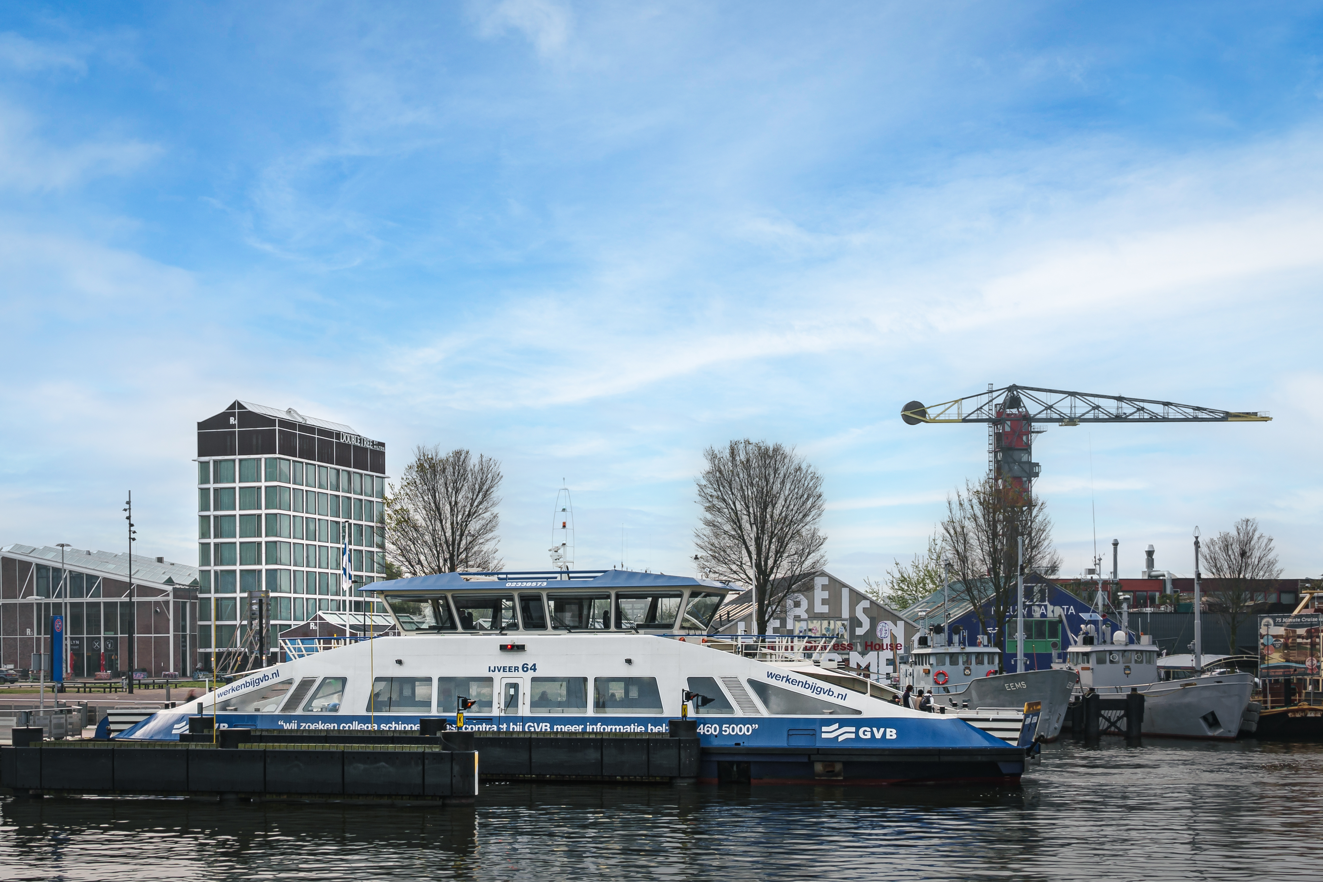 a Boat on the Water and View of DoubleTree Hotel Exterior