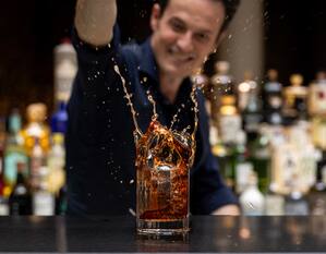 Bartender Making a Drink at Axis Lobby and Cocktail Bar