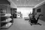 Spacious fitness center with modern cardio equipment and free weights