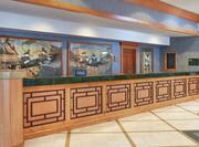 Reception desk with Alaskan art on display on the wall