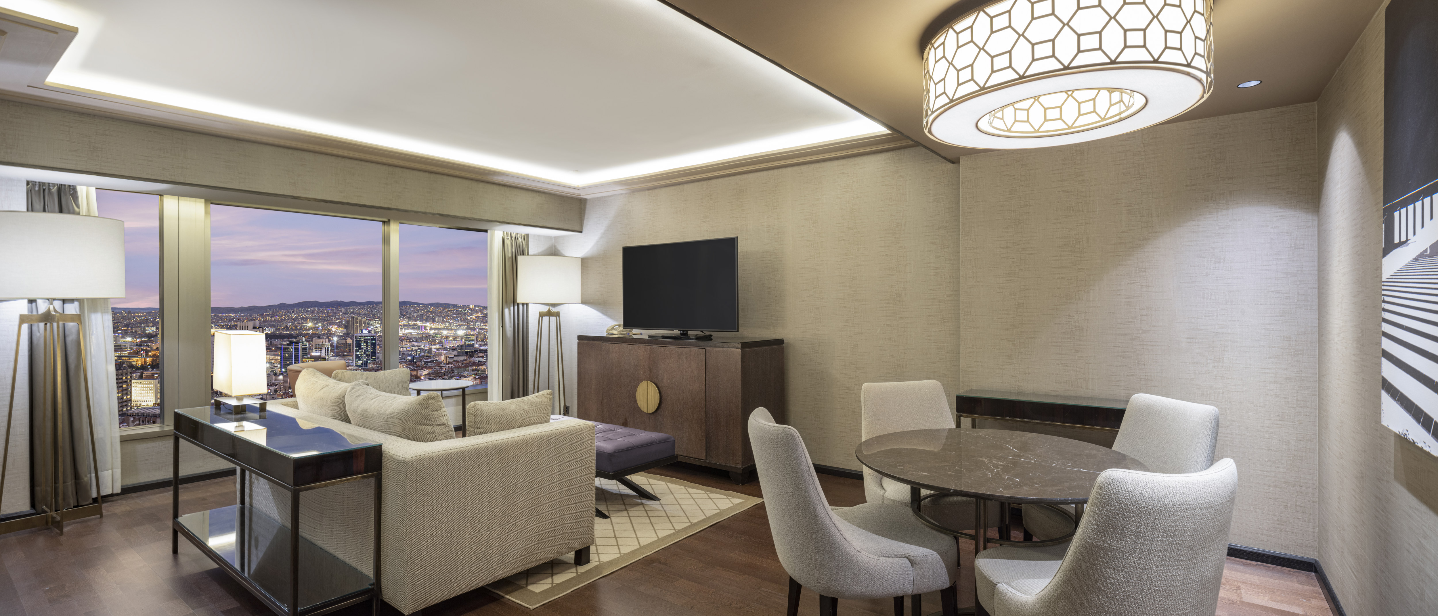 Suite Living Room with Large Windows and City View