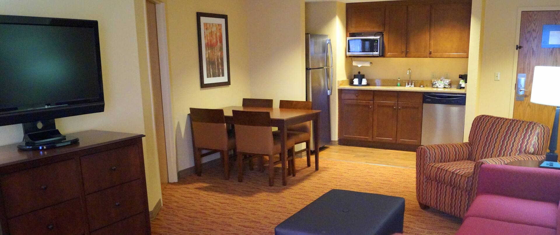 Living Area, Table and Kitchen in Suite