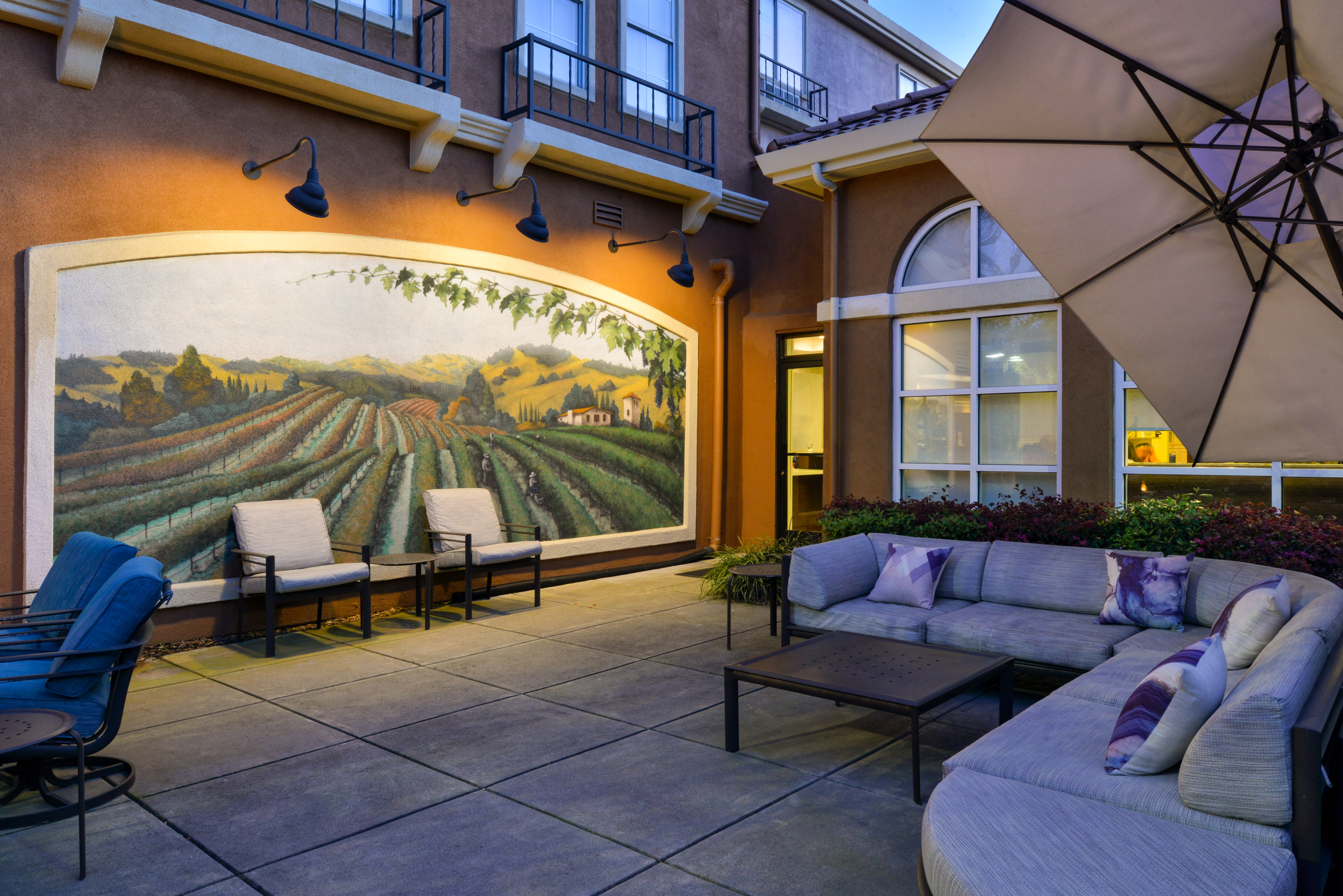 outdoor patio, lounge chairs, vineyard wall mural