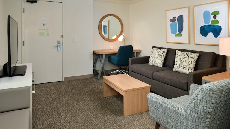 guest suite lounge area, sofa, chair, work desk, tv