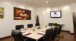 Seating for 8 Around Boardroom Table, Wall Art, and and TV Above Decorativv Table