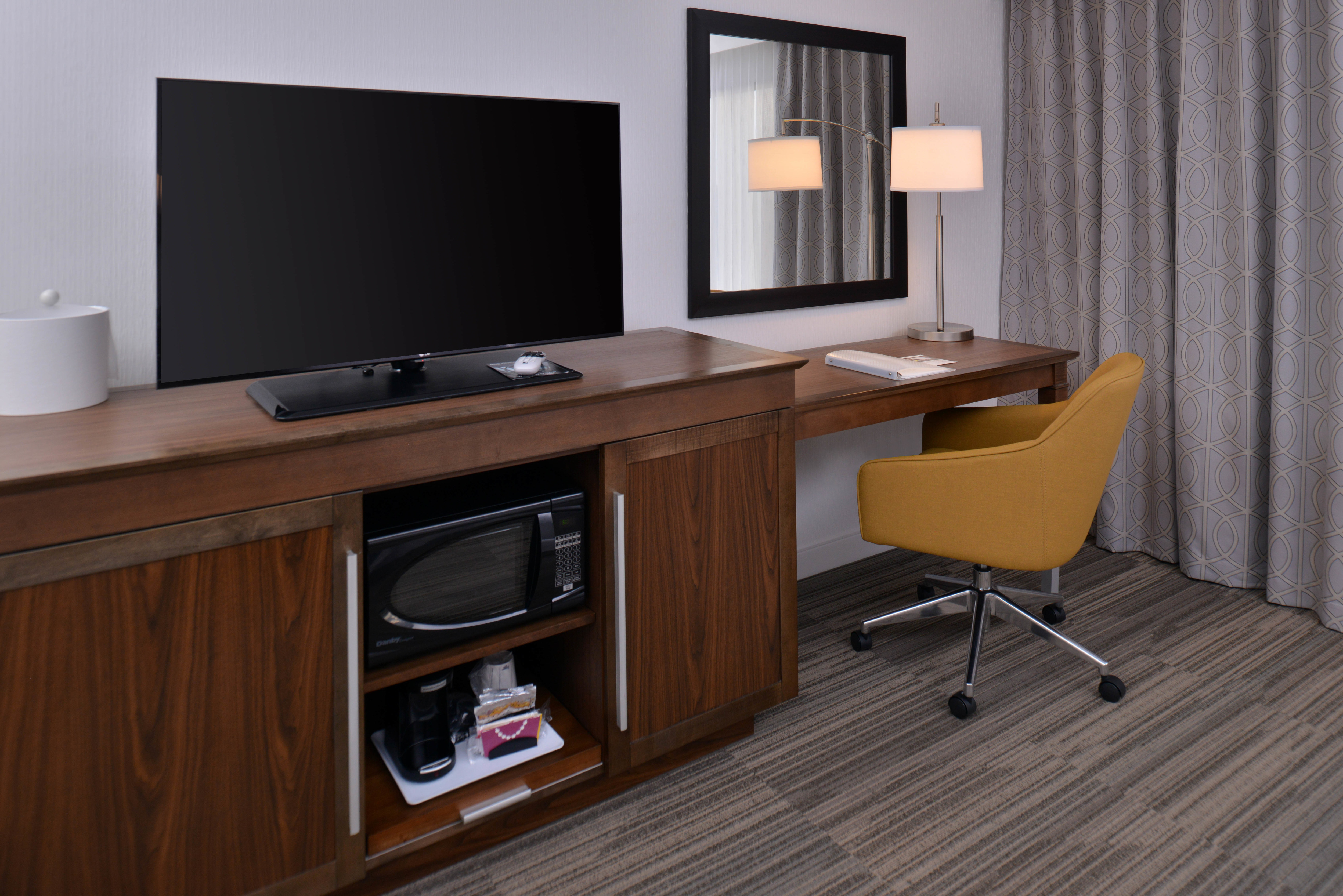 TV and Desk in Room  