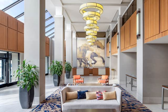 Lobby Seating Area with Sofas and View of Reception Desk