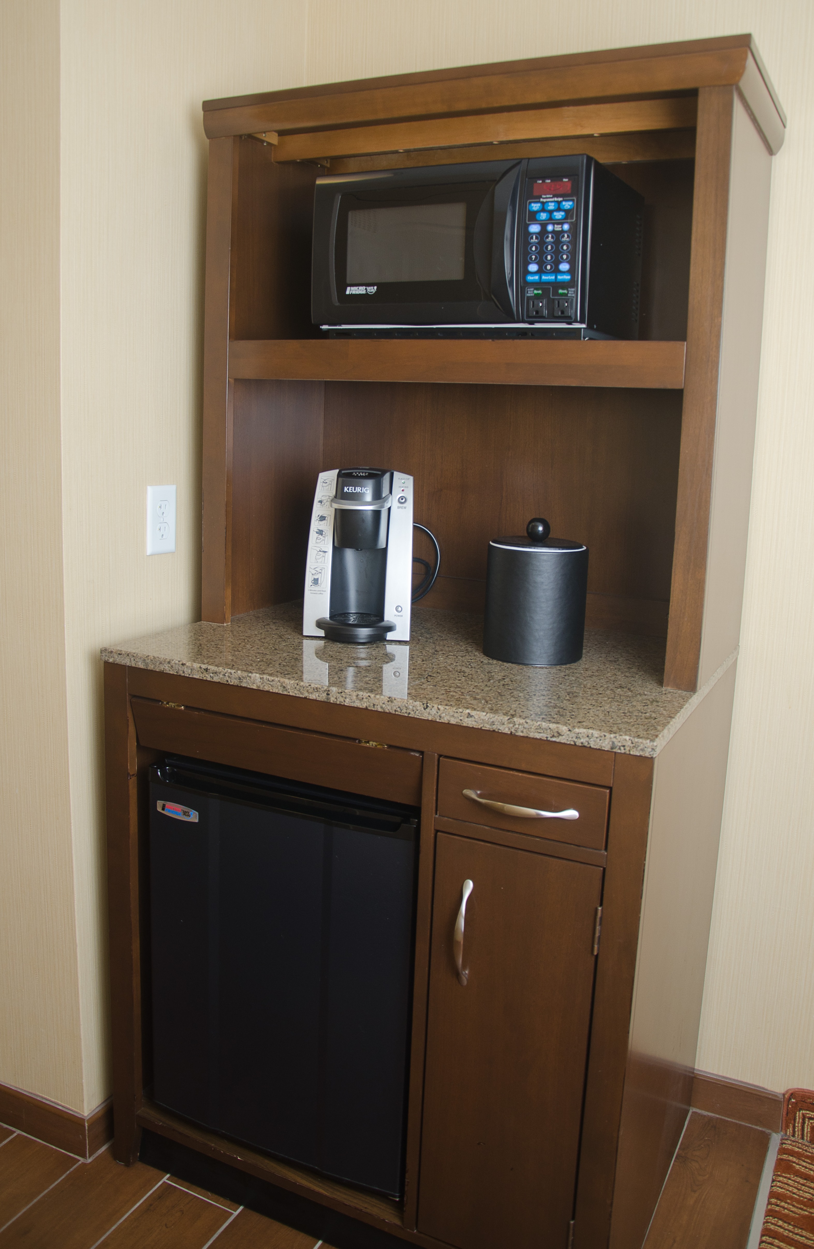 Kitchen area with microwave, coffee maker, and microfridge.
