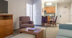 Hearing Accessible Suite with Couch, Television and Kitchen