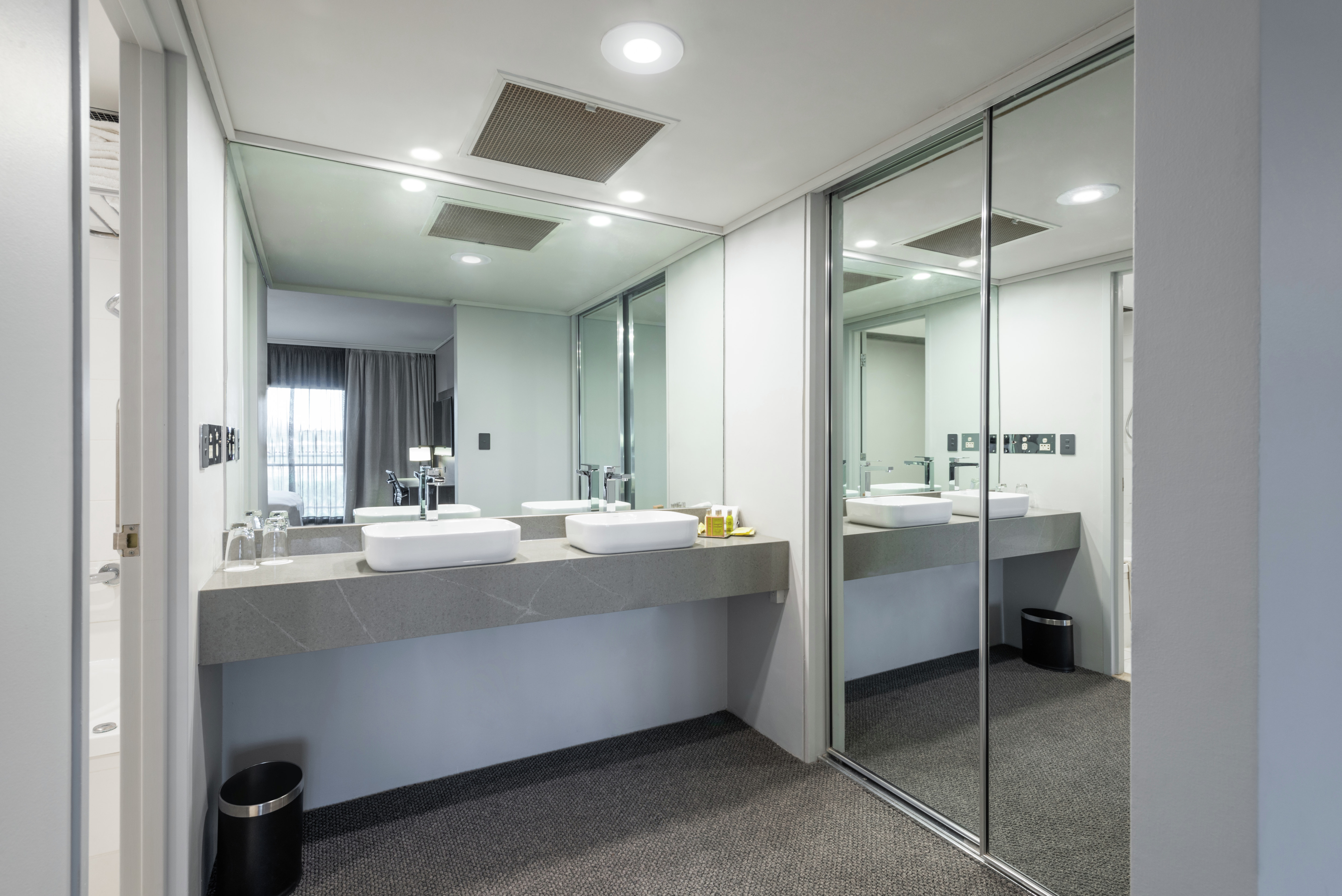 Suite Bathroom with Dual Vanity Area and Large Mirror