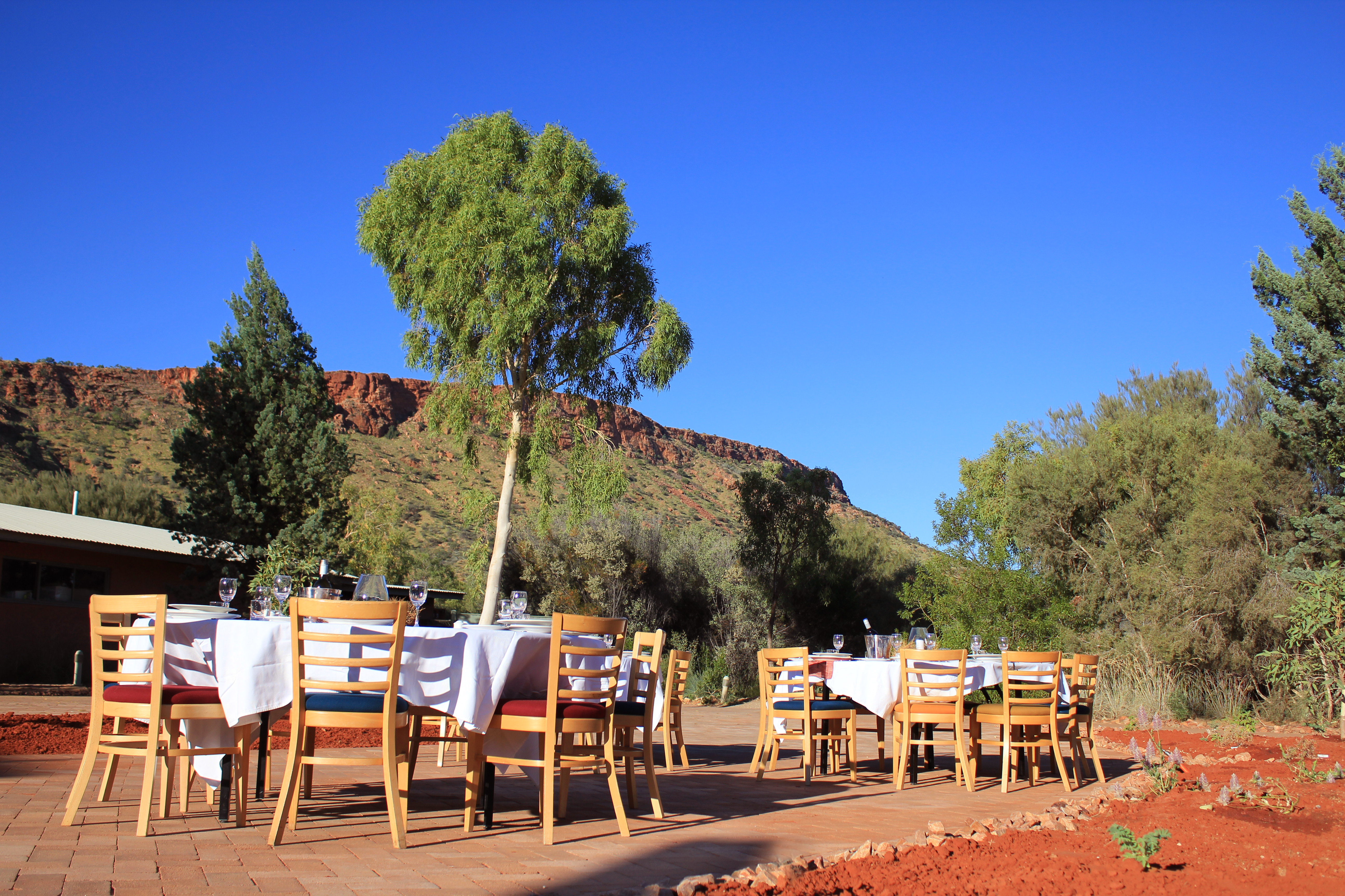 Round Tables With White Cloths Set For Dinner Event at Alice Springs Desert Park 