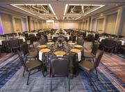 Spacious Ballroom with Round Tables and Chairs