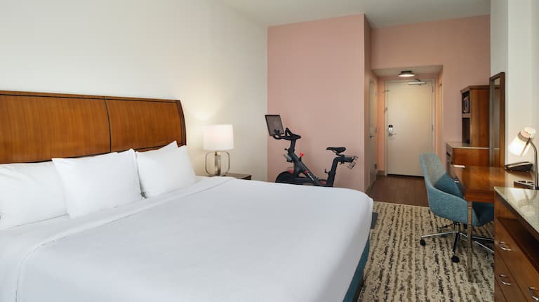 king bedroom with peleton bike