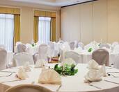 Wedding Tables with White Chairs and Napkins