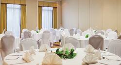 Wedding Tables with White Chairs and Napkins