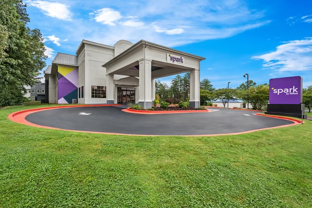 daytime exterior showing front of building with sign