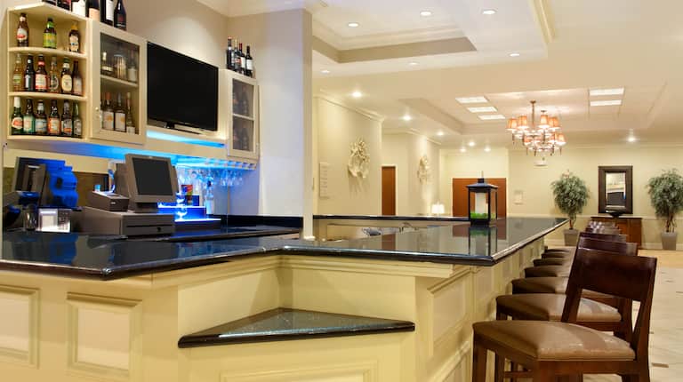 Lobby bar with seating area and TV.
