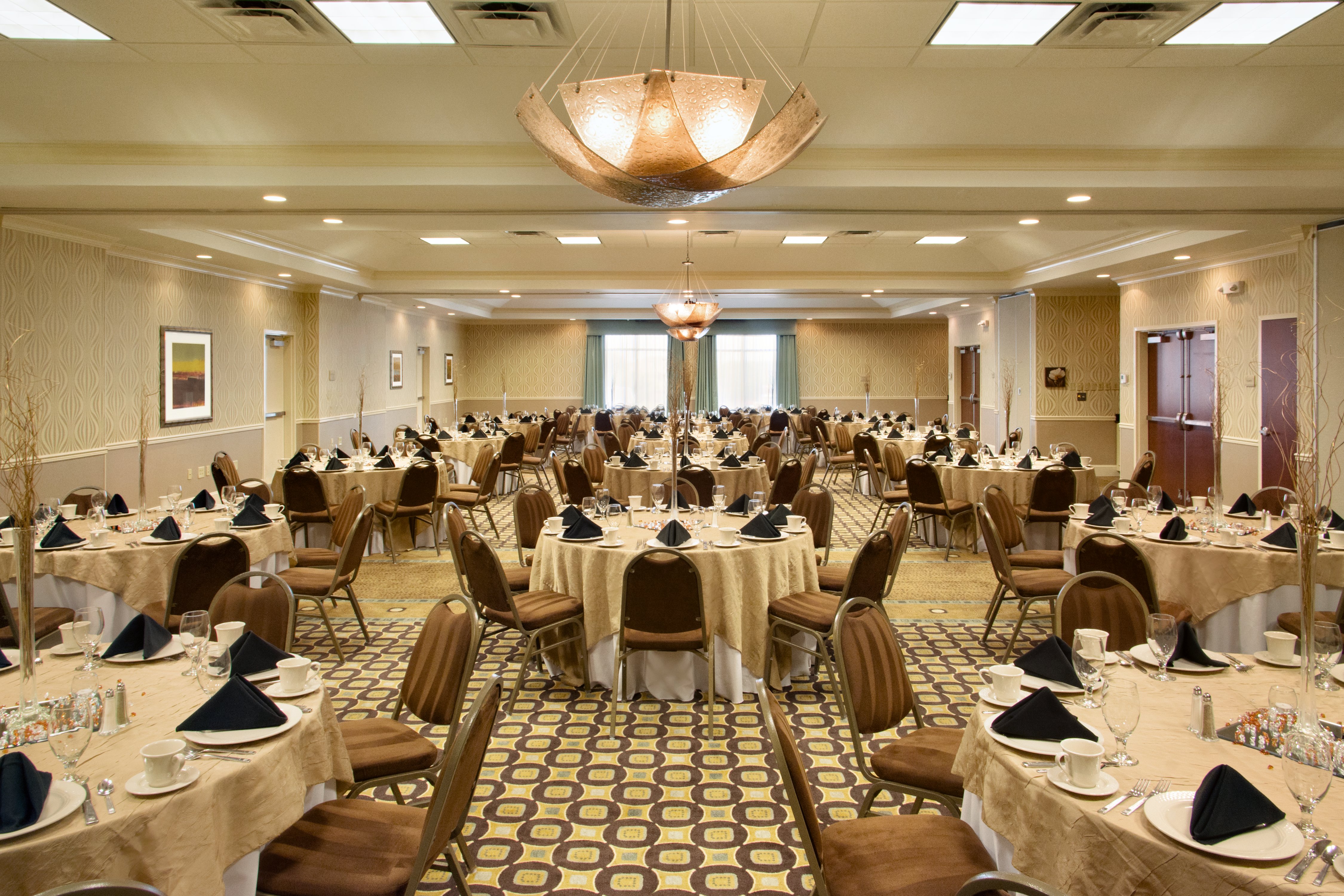 The Grand Ballroom with set tables and chairs.