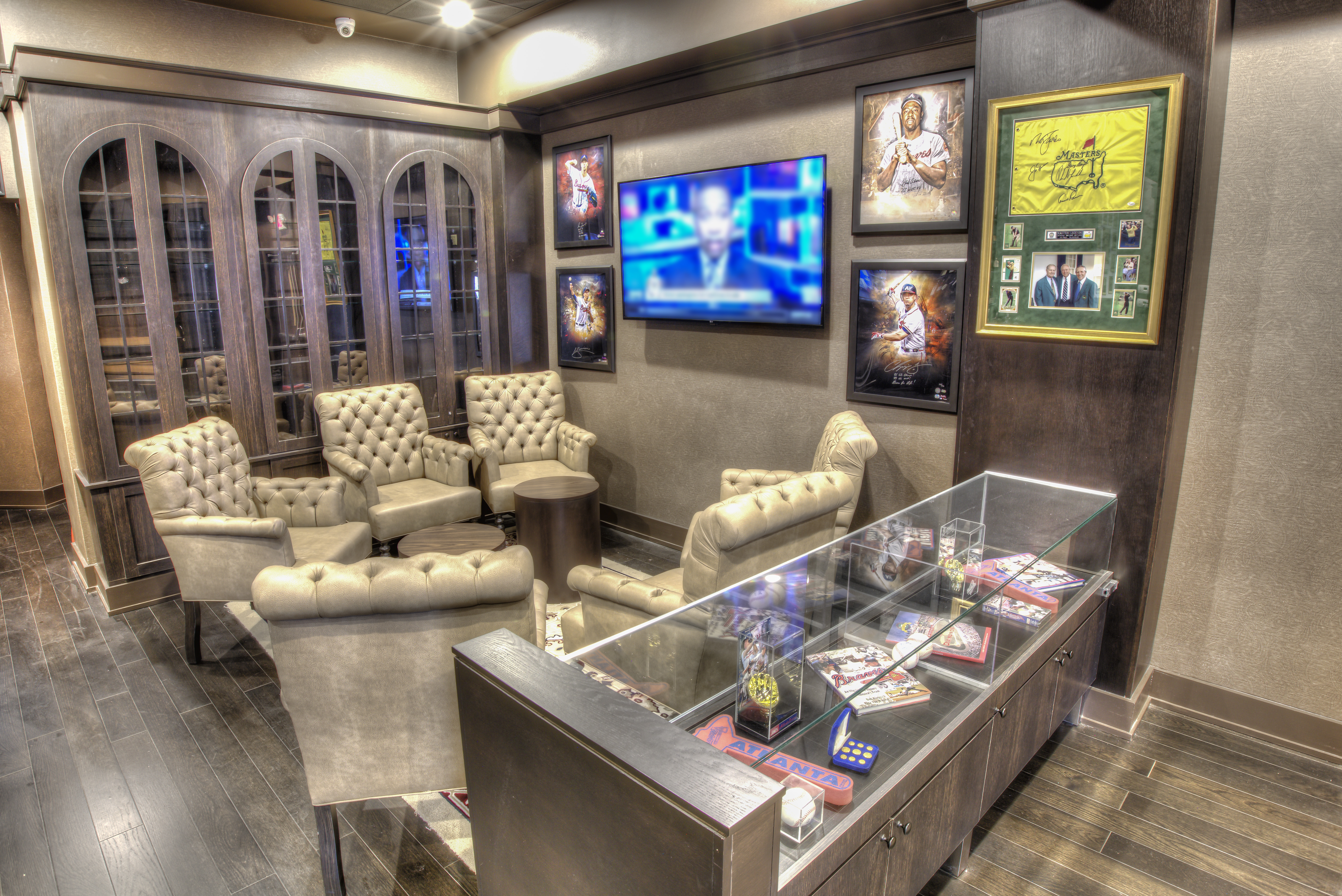 Lounge Seating, Sports Memorabilia, and TV in Brightly Lit Gamer Changer Bar
