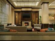 lobby area with couch and fireplace