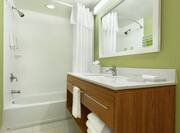 Vanity and Bathtub in Standard Bathroom