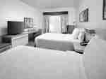 Two Queen Guestroom with Two Beds, Lounge Area, Work Desk, and Room Technology