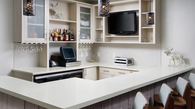 Bar with Drinks, Counter, Chairs, and HDTV